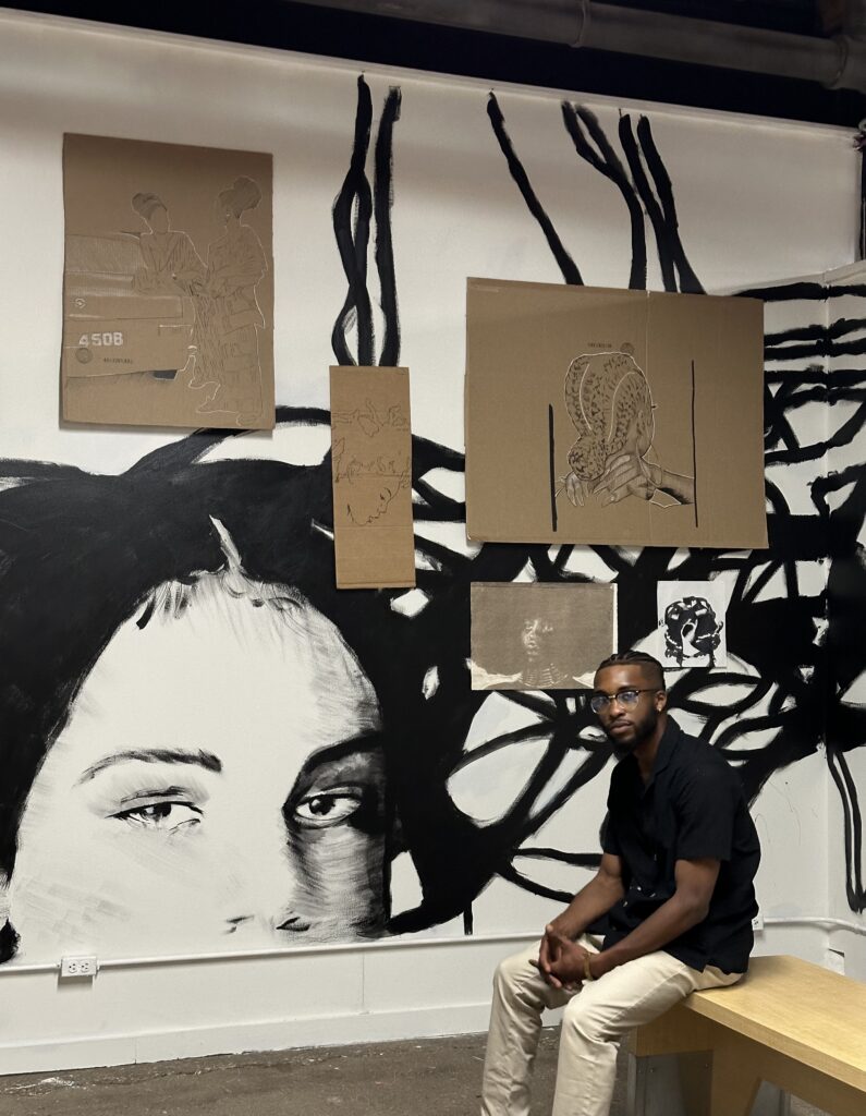 Artist Alan Atkins, pictured beside Atkins' work.